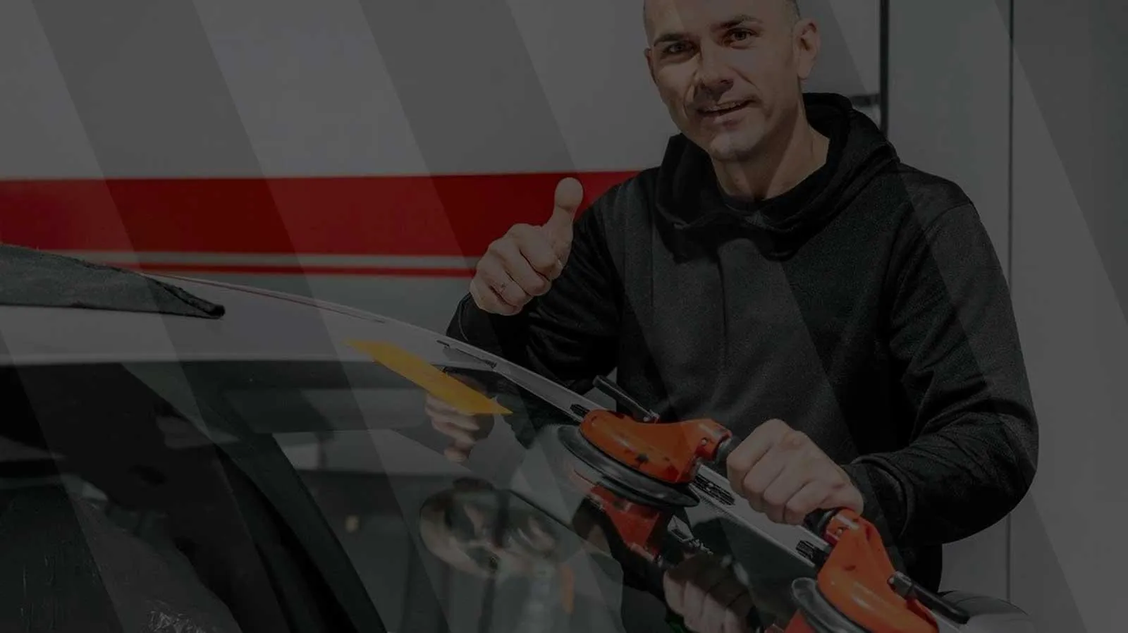 Very Smooth Auto Glass technician setting OEE glass during a windshield installation in Roseville CA