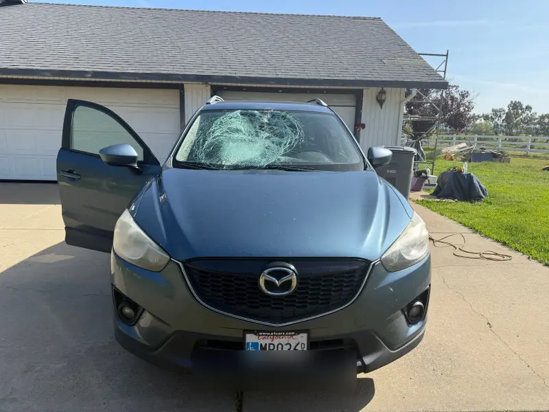 Mazda windshield damage — chip that spread into a crack